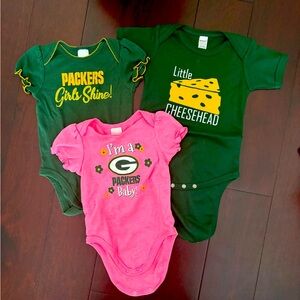Green Bay Packers Onsies. Two are 6-12 months and one is 12-18 months.
